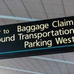 Sacramento Airport Bomb Scare Deepens Airport sign for Baggage Claim and other destinations.
