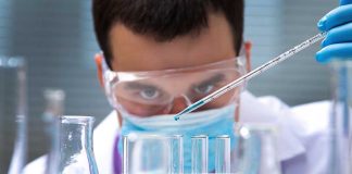 California Measles Alert: No Patients, No Outbreak — Just Sewage Scientist conducting an experiment with blue liquids in a laboratory