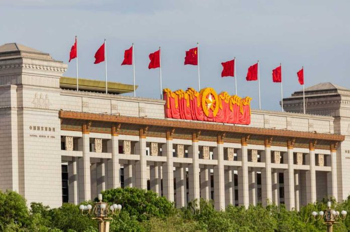 shutterstock_1987309406 Facade of the National Museum of China adorned with red flags and decorative elements
