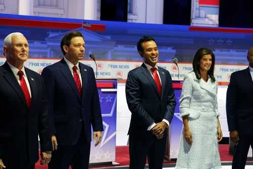 Public figures stand in line at a Fox News event.