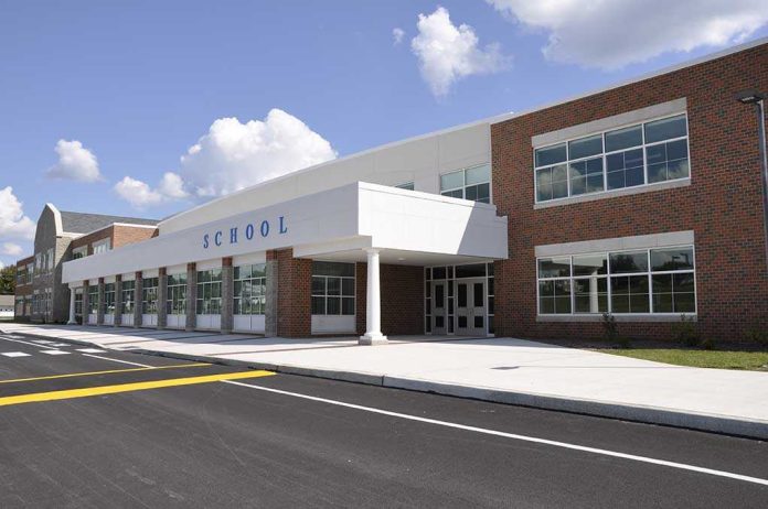 shutterstock_37352986-1 Modern school building with large windows and a clear sky
