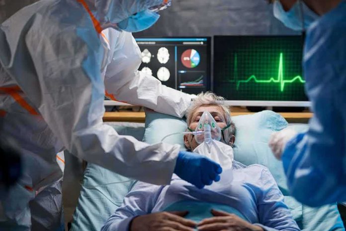 Patient on hospital bed with oxygen mask