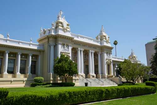 Exterior view of a historic courthouse with columns and decorative architecture