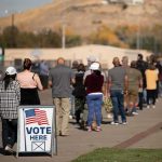 Court Clash: Who Controls Elections Now? voters standing in a long line outside a polling place