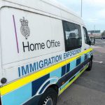 Crystal Bags Spark FBI vs. DA Clash Immigration enforcement van parked on a street