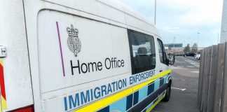 Crystal Bags Spark FBI vs. DA Clash Immigration enforcement van parked on a street