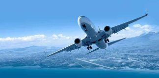 Civilian Planes Breach No-Fly Zone Commercial airplane banking over coastline