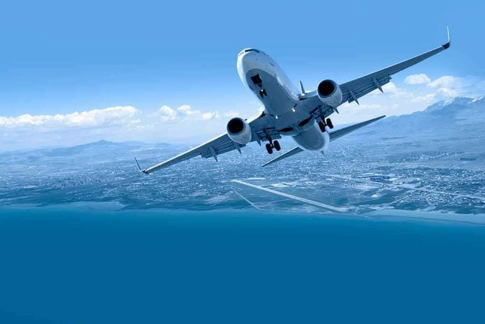 Commercial airplane banking over coastline