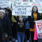 Feds Raided — Now Chicago Wants Payday Protesters march holding signs and banners