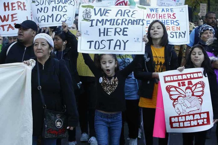 Protesters march holding signs and banners