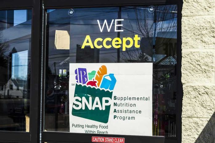 shutterstock_596629331 Store window sign indicating SNAP acceptance