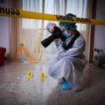 Autopsy Ordered After Epstein Associate Dies forensic photographer documenting indoor crime scene