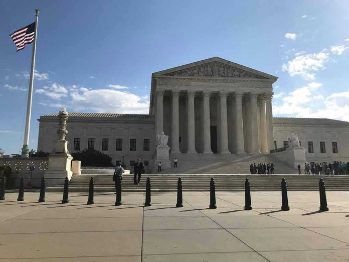 2453289175-1 Supreme Court building with flag and people outside.