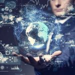 Businessperson holding a digital globe with data interfaces