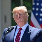 Bank Flags Trigger Trump Account Purge person at podium with microphone outdoors