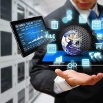 Businessperson holding a digital tablet with floating data icons