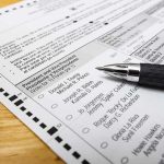 Court Smacks Down Troop Paperwork Gambit Ballot paper with pen on wooden surface
