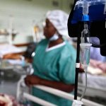IV drip and blood pressure gauge in a hospital ward