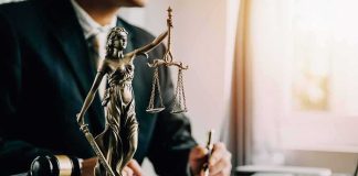 Lady Justice statue on a lawyer’s desk