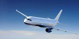 UK Bets Big On Contrail Crackdown Passenger airplane flying above clouds