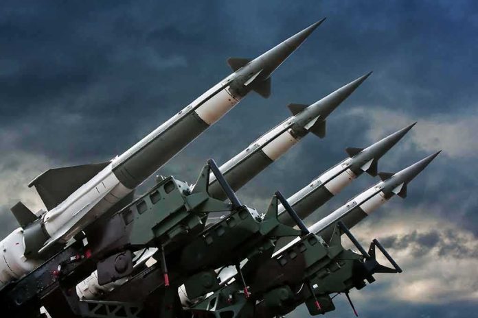 Surface-to-air missiles mounted on launchers against a stormy sky