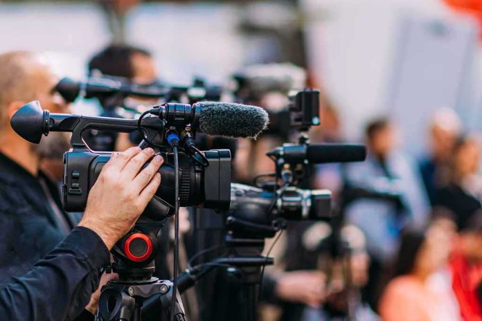 Video cameras on tripods at a media event