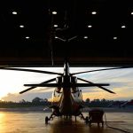 Helicopter Smash—Troopers Hurt Helicopter in a hangar at sunset