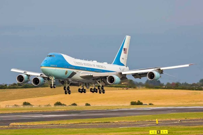 shutterstock_1135671161 Airplane landing on runway with landing gear extended