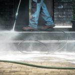 Viral Videos Fuel Candidate’s Mayoral Surge! Worker pressure washing outdoor steps