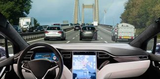Self-driving car interior on a busy bridge highway