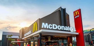 McDonald’s Grab Stop Stuns Crown Heights McDonald's restaurant exterior with drive-thru at sunset
