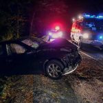 Revoked License, Repeat Reentry, Deadly Crash Crashed car on a dark roadside with emergency vehicles