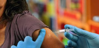 Nurses Mobilize Power — Ethics Make It Mandatory Healthcare worker administering vaccine in upper arm