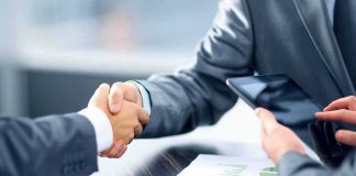 Washington Floats Wild AI Alert Lane Businesspeople handshake at meeting table