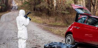 AI Camera Sparks 13-Day Jail Nightmare forensic investigator photographing crime scene near red car on forest road