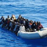 Border Meltdown: 10,000 And Rising Dontrelle Inman and Colin David Jones among a crowded inflatable boat at sea