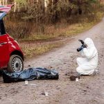 Cartel Chaos: Bodies Found In Ranchlands forensic investigator photographing evidence near red car on dirt road