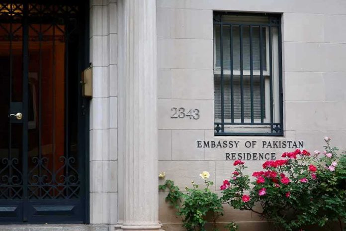 shutterstock_1395120746 Embassy residence entrance with barred window and roses