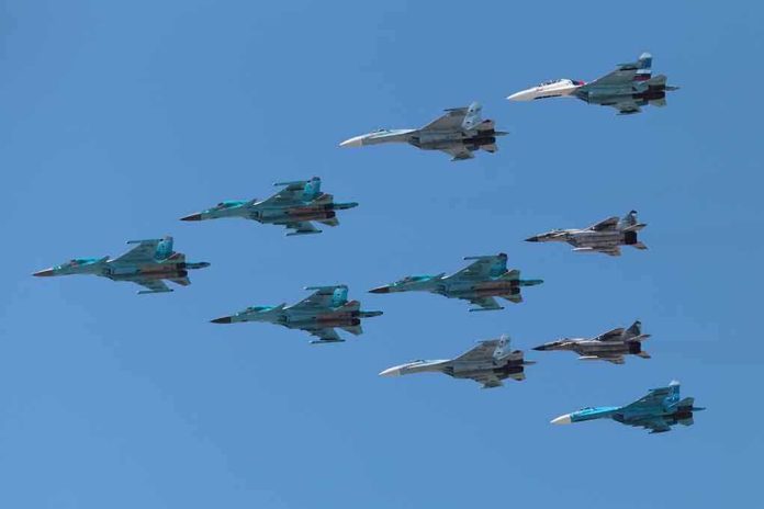 shutterstock_141377446 A formation of military jet fighters flying in a clear blue sky