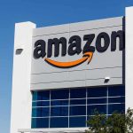 Amazon Ad Bills Soar—Invisible Floor Alleged Amazon logo on a modern building facade