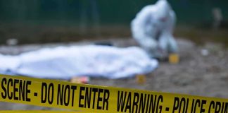 Apartment Path, Tub Falls – Case Explodes Crime scene with police tape and forensic investigator