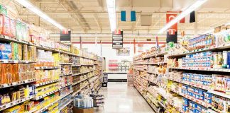 A grocery store aisle filled with various food products on shelves