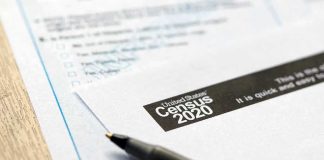 Census form with pen on a wooden table
