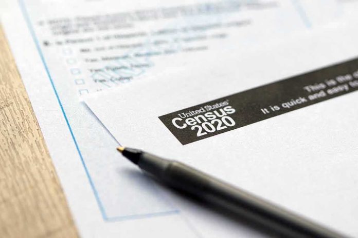 Census form with pen on a wooden table