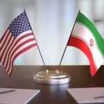 Big Win Or Bait? Iran Terms Still Hidden United States and Iran desk flags on a stand