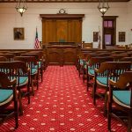 Councilman Targeted—Justice Finally Comes Courtroom with wooden benches facing the judge's bench