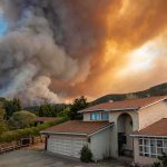 Mystery Ignition, Massive Destruction Suburban house under towering wildfire smoke plume