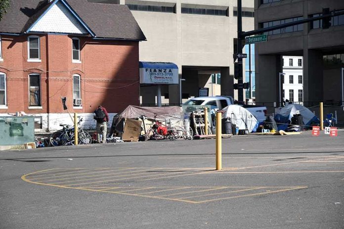shutterstock_1847950321 Homeless encampment with tents along a city street
