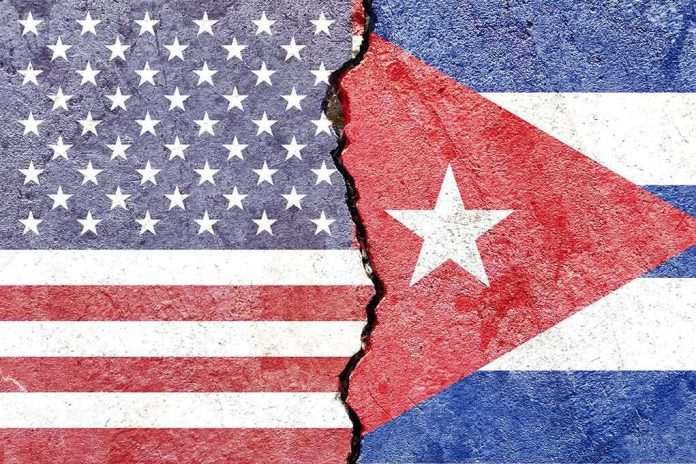 shutterstock_1894922731 Split wall showing USA and Cuba flags divided by a crack