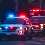Fiery News Chopper Crash Stuns L.A. Police SUV and ambulance with flashing lights at night